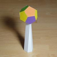 Paper model dodecahedron on pedestal